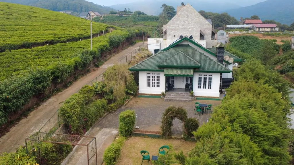 Hillcroft Villa and its garden, surrounded by tea fields